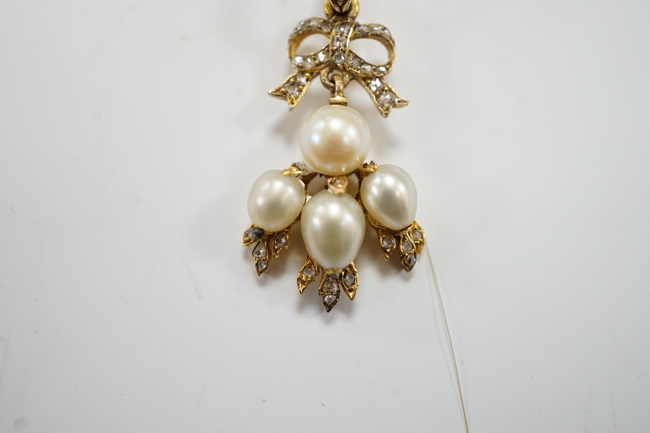 A yellow metal, cultured pearl and rose cut diamond cluster set drop pendant, 34mm, gross weight 3.4 grams.